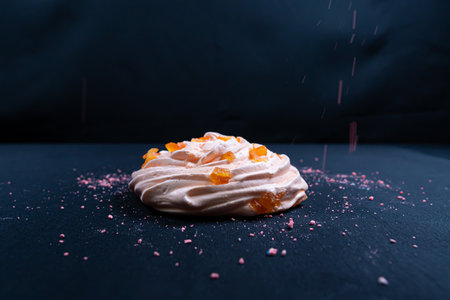 A popular French meringue dessert on a black background. Closeup.の写真素材