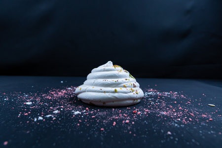 A popular French meringue dessert on a black background. Closeup.の写真素材