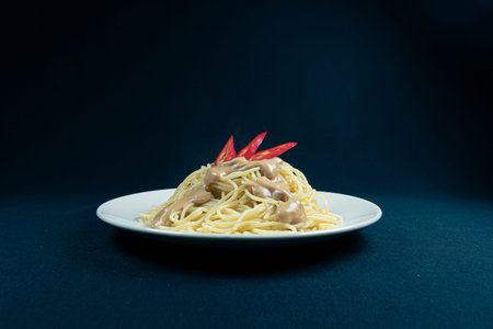 Spaghetti with mushrooms and mint in a cream sauceの写真素材