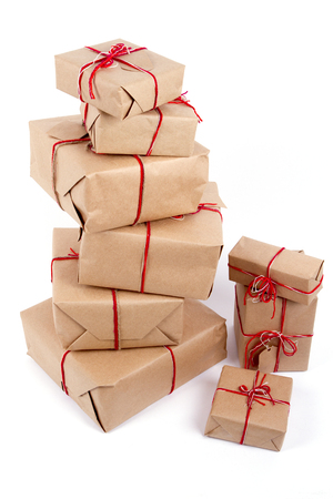 Stack of handcraft gift boxes on white backgroundの写真素材
