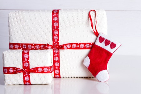 white gift box with polka dots and Santa's socks - Preparing for the New Year and Christmasの写真素材