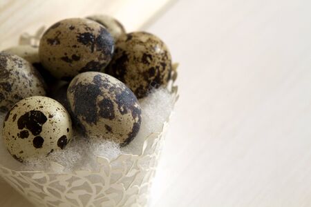 quail eggs in a paper basket. space for textの写真素材