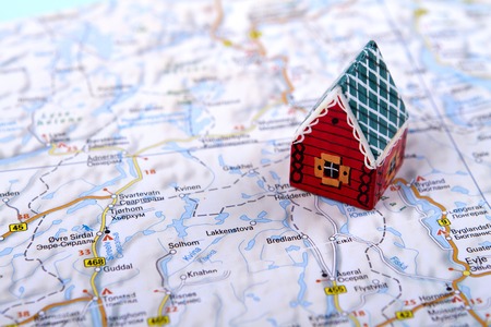 little toy house on the map. concept of travel, rent abroad. a family holiday on lodgy term. holidayの写真素材