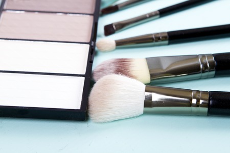 set of makeup brushes and highlighter for face tone. fashionの写真素材