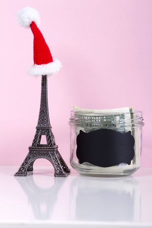 concept save on travel for New Year and Christmas holidays. Travel to Paris. pink backgroundの写真素材