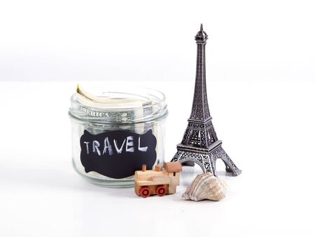Travel to Paris, France concept with Eiffel Tower souvenir and wooden train toy. Planning summer vacation, money budget trip concept.の写真素材