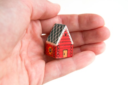 little red house in a hand dream investmentの写真素材