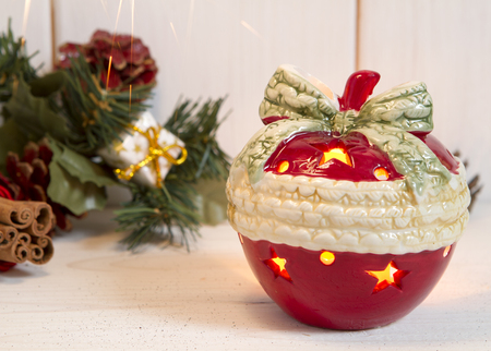 candlestick in the form of New Year's apple. on a wooden background. preparations for the Christmas and New Year 2017. sparklersの写真素材