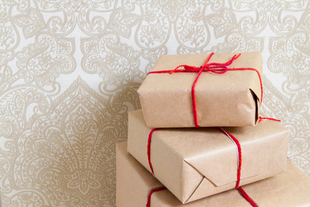 pile of gifts at home on a background of vintage wallpaperの写真素材