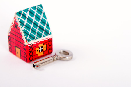 toy House and key. Isolated on whiteの写真素材