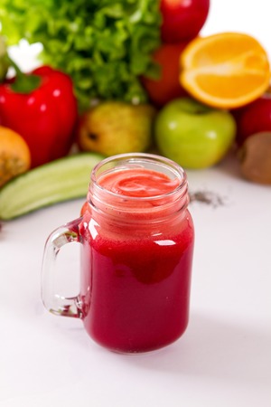 Healthy vegetable smoothie in a glass jar with handlebreakfast detoxの写真素材