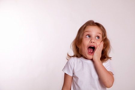 Surprised girl kidの写真素材