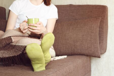 Woman Sofa Bed with book Rest Plaidの写真素材