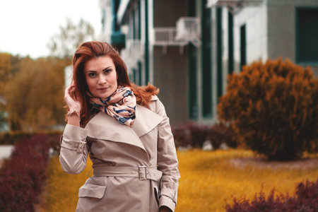 trendy girl posing at the city autumnの写真素材
