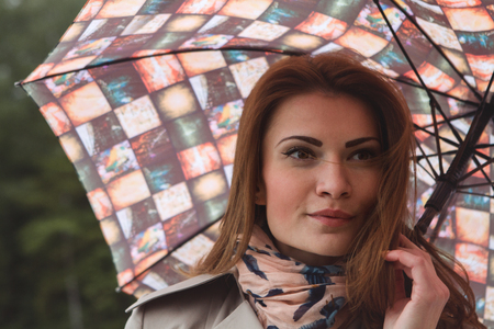 woman under an umbrella outdoor autumnの写真素材