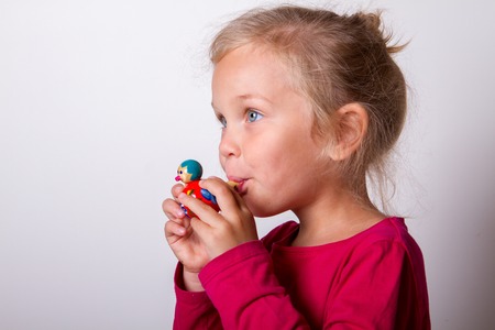 child blows into the whistleの写真素材