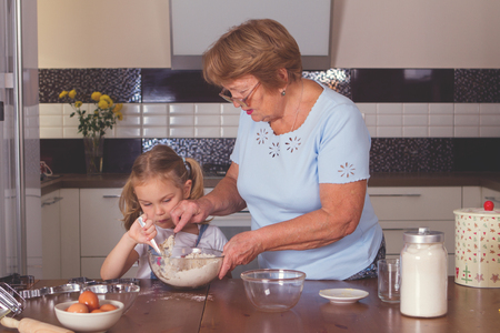 grandmother and granddaughter cookの写真素材