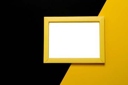 Empty white frame on two color background with copy space.の写真素材