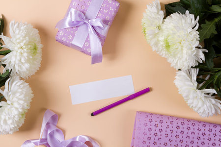 Flowers, a gift and a white blank
