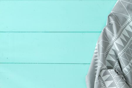 top view of checkered napkin on wooden tableの写真素材