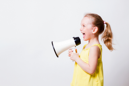 child screams into a megaphoneの写真素材