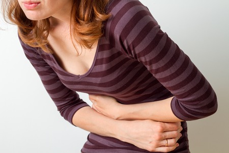 Woman has stomach acheの写真素材