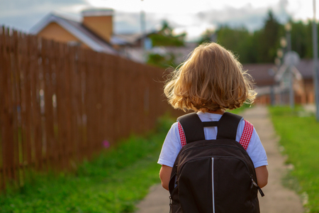 little girl with a backpackの写真素材