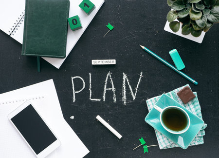 Planning for the future. Top view on the desktop graphite stock. On the table is a notebook with a...