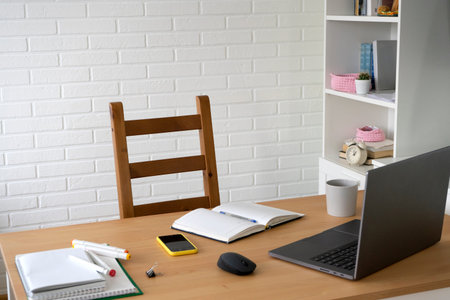 empty workplace with laptop and office supplies. concept of work and study at home.