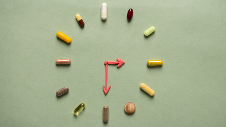 Symbolic clock with plasticine hands and a pill and vitamin dial.の写真素材