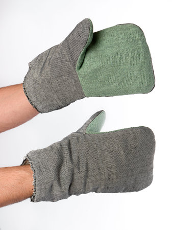 cotton work mittens on male hands on a white background