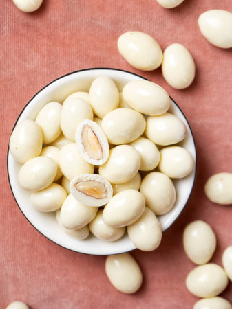 dragee from almonds in white chocolate. Chocolate balls with nut filling.の写真素材