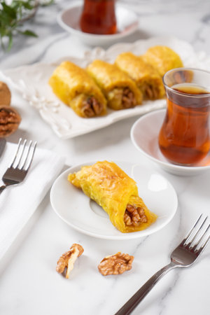 Oriental sweets. Turkish delight, pistachio baklava. Fragrant tea. Still life with Turkish mood. For advertising, window dressing, travel posters and cafes.の写真素材