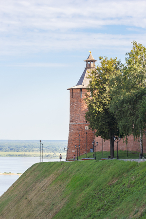Taynitskaya tower of the Kremlin and green trees in Nizhny Novgorod in the summerの写真素材