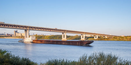 Cargo ship passes under the bridge in Nizhny Novgorod