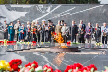 Eternal flame, flowers, war veterans in May 9の写真素材