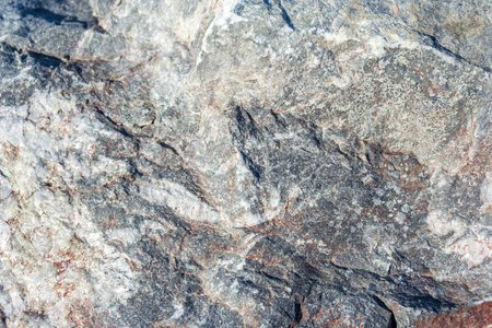 The texture of granite illuminated by the sun