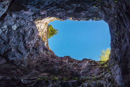 View of the sky from the underground tunnel in the park Ruskeala, Russiaの写真素材