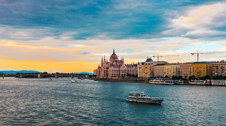 Boat on the Danube river, Hungarian Parliament Building sunset in Budapestのeditorial素材
