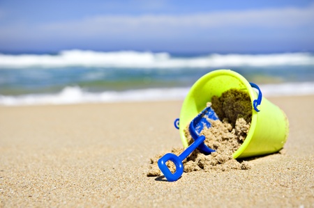 Toy bucket and shovel on the beachの写真素材