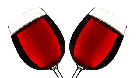 Close up of two glasses of red fruit juice on a white backgroundの写真素材