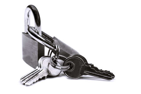 Close up of locks and keys on a white background with space for textの写真素材