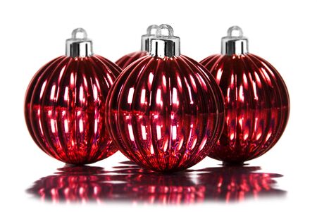 Red christmas decoration baubles on white backgroundの写真素材