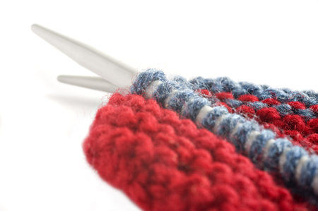 Woolen thread and knitting needle  Needlework accessories on white background 