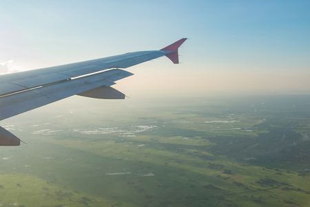 green field view from the airplane windowの写真素材