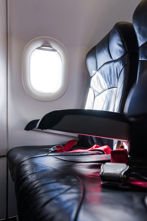 Airplane seat with white empty window.の写真素材