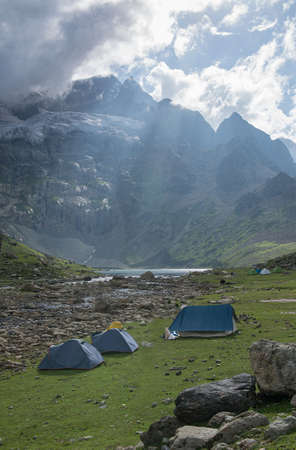Beautiful Gangabal lake at Kashmir Great lakes trek .Camping tents at the Nundkol lake which is near the Gangabal lake, at the base of Mount Harmukh. This is the last lake on the Kashmir Great Lake trek which is an alpine high altitude trek in Kashmir.のeditorial素材