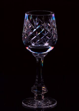 Crystal glass on a black background with color highlightsï¿½の写真素材