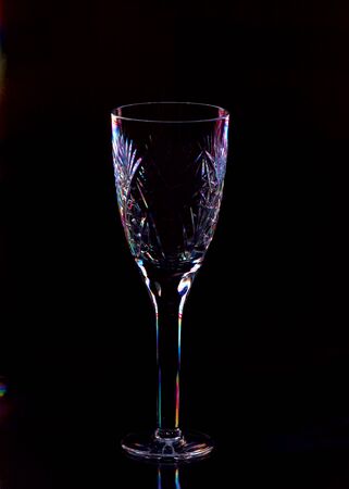 Crystal glass on a black background with color highlightsï¿½の写真素材