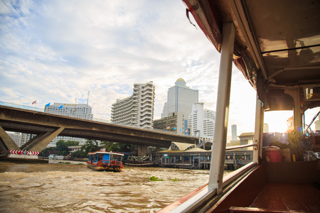 Bangkok ,Thailand - August 31, 2017 : Bangkok View from inside Chao Phraya river Express Boat can see riverfront and building with morning light.のeditorial素材